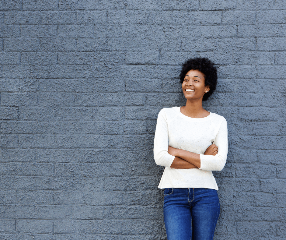 woman entrepreneur against a wall growth mindset